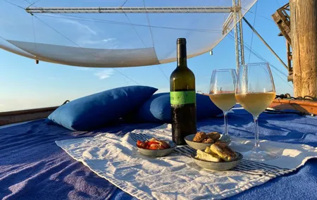 Aperitif at sunset in the Venice lagoon on a private boat.