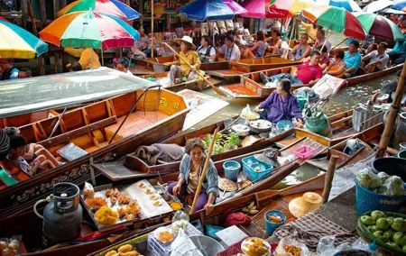 Maeklong Railway Market & Damnoen Saduak Market Paddle Boat Tour