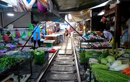 Meet Thai locals and tour Maeklong Railway Market with lunch