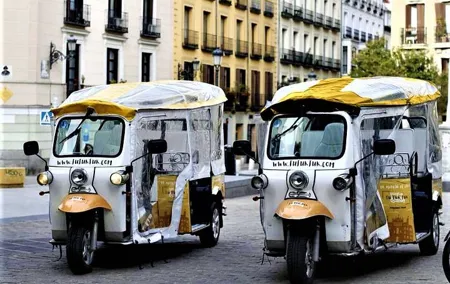 Tour of Historic and Modern Madrid with a guide in a yellow tuk tuk