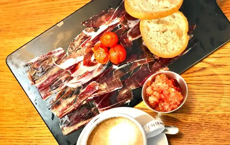 Iberian ham experience with traditional breakfast in center Madrid