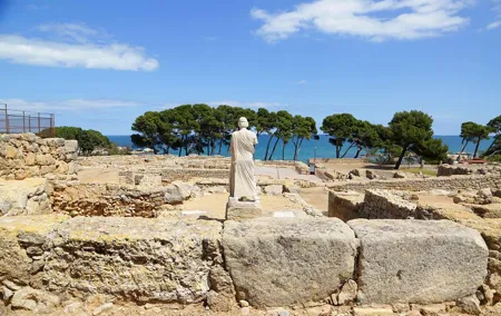 Costa Brava and Empuries Small Group Tour with Hotel Pick-Up and Boat Ride