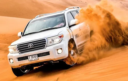 Dubai Desert Safari With Dune Bashing, Camel Ride & BBQ Dinner