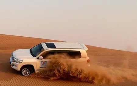 Private Dubai Desert Safari with BBQ Dinner & Sandboarding
