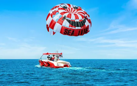 Parasailing in Dubai with Palm Jumeirah and JBR Beach views