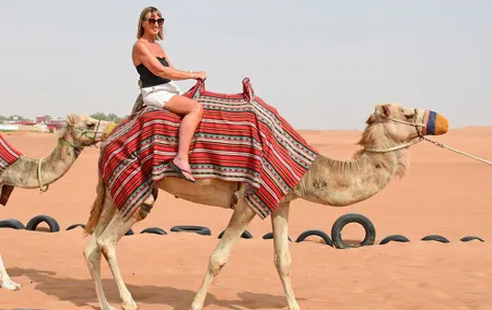 Thrilling Morning Red Dune Desert Safari with Camel Ride in Dubai