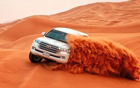 Red Dune Desert Safari with Camel Riding Sand Boarding BBQ Dinner