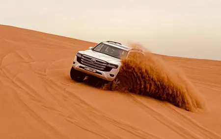 Dubai Sunrise Desert Safari Red Dune Camel Falcon & Sandboarding