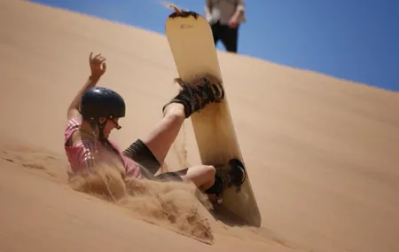 Private Desert Sandboarding Camel riding tour