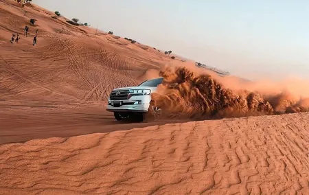 Evening Desert Adventure: Quad Biking, Sandboarding & Camel Ride
