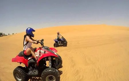 Evening Desert Safari BBQ Dinner & Quad Bike Sand boarding Camel