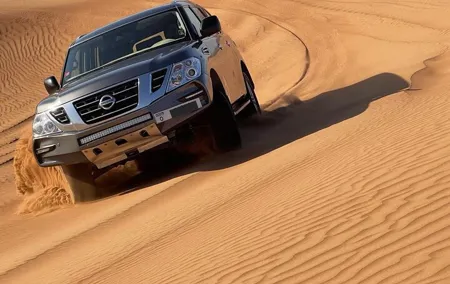 Private Afternoon Desert Safari with Quad Bike, Camel Ride and Sandboarding