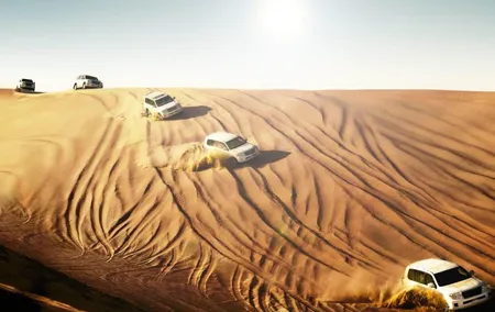 Dubai Desert Safari With BBQ Dinner, Camel Ride, Belly Dancing and sandboarding