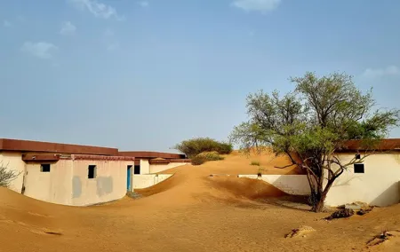 The Ghost Village Safari Tour with Dune Bashing and Sandboarding