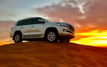 Dubai Dune Bashing with Camel Ride, Sandboarding & BBQ Dinner