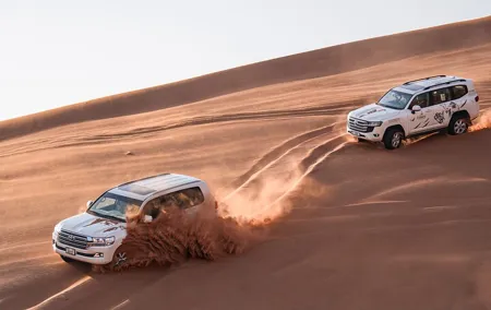 Evening Desert Safari in Dubai, Sandboard & BBQ Dinner