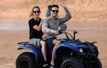 Red Dunes by Quad Bike with VIP Camp, Camels, Sandboarding & Falcon