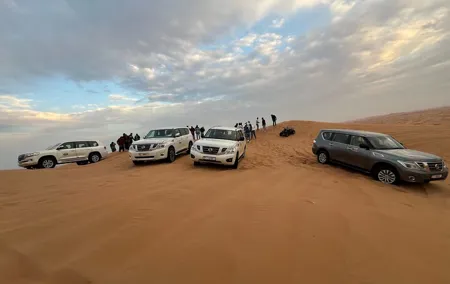 Red Dune Desert Safari Camel Ride, Sandboarding with BBQ Dinner