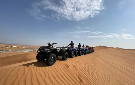 Guided Desert Quad Safari with Camelride, BBQ-Dinner and live-Shows