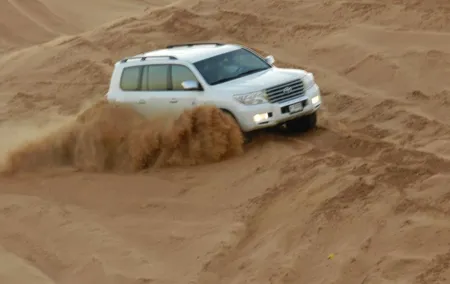 Morning Red Dunes Desert Safari With Camel Ride And Sand Boarding