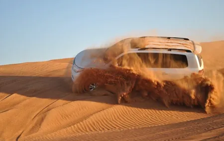 One hour Quad Bike at Red Sand Desert Safari with Camel Ride and BBQ Dinner