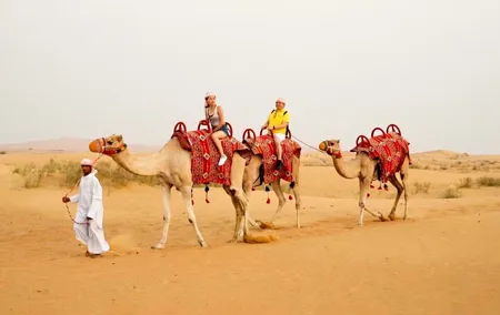Sunset Camel Trek with Sandboarding and Lavish BBQ Dinner Buffet