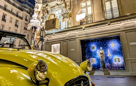 The magical illuminations of Christmas in Paris in an antique car!
