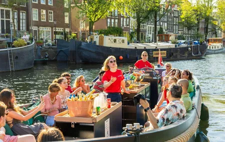 Amsterdam: Guided Open Boat Canal Cruise Unlimited Drinks Option