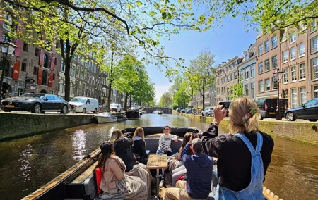 Amsterdam Canal Tour by Open Boat – 90 min Small Group Experience