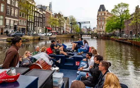Amsterdam Open Boat Cruise with Live Guide and Two Drinks