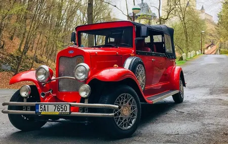 Karlstejn Castle in Vintage Convertible Car