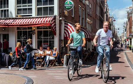Amsterdam PRIVATE Bike Tour With Locals: Bike & Local Snack Included