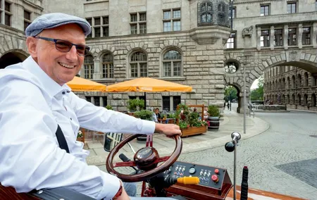 first electrical carriage in town - guided City Tours - Leipzig