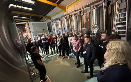 Brewery bus tour, 4 breweries, 12 beers, 1 pizza, 1 bus