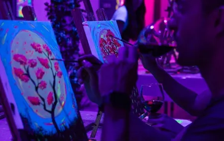 Paint a neon fluorescent picture while drinking unlimited wine