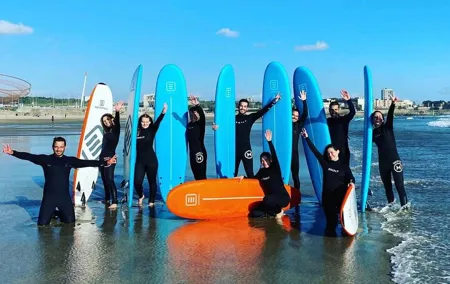 Small Group Surfing Experience with Transportation in Porto