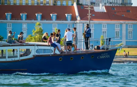 Classic Yacht Sunset group tour in Lisbon with welcome drink