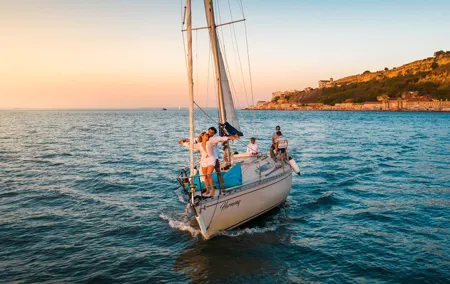 Lisbon: "Sunset" and "Day Tours" by boat, with drinks and Music.