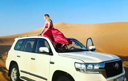 Private Morning Safari Camel Ride, Dune Bashing and Sandboarding